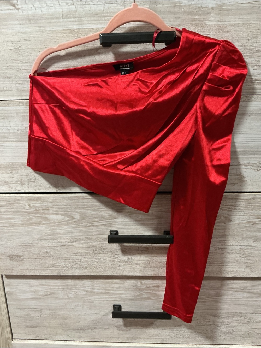 Red Asymmetrical One-Sleeve Satin top.